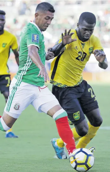  ?? FILE ?? Jamaica’s Kemar Lawrence (right) challenges Mexico’s Elias Hernandez during a Concacaf Gold Cup semi-final in Pasadena, California, on Sunday, July 23, 2017.