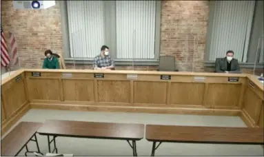  ?? COURTESY ?? Plastic barriers have been installed in the Amherst City Council Chambers in town hall, 206S. Main St. in Amherst. For the first time since the pandemic started, council members met March 8in the chambers.