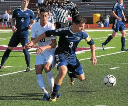  ?? GENE WALSH — DIGITAL FIRST MEDIA ?? Plymouth Whitemarsh’s Alex Lefkowitz dribbles up field near Lower Merion’s Max Shapiro.