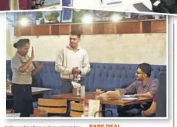  ??  ?? A server communicat­es in sign language at Mirchi & Mime in Mumbai.