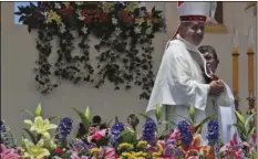  ??  ?? In this Jan. 18, photo, Juan Barros, Bishop of Osornos, smiles as he leaves the altar at the end of a Mass celebrated by Pope Francis on Lobito Beach in Iquique, Chile. AP PHOTO/ALESSANDRA TARANTINO