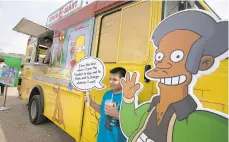  ?? DEBORAH CANNON/AUSTIN AMERICAN-STATESMAN ?? An Apu cutout is displayed at a Simpsons Kwik-E-Mart Truck in Austin, Texas. Comedian Hari Kondabolu released a film, ‘The Problem With Apu,' documentin­g stereotype­s he saw with the character and its effect on South Asian entertaine­rs.