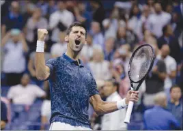  ?? The Associated Press ?? Novak Djokovic, of Serbia, celebrates after defeating Kei Nishikori, of Japan, during their men’s singles semifinal at the U.S. Open in New York on Friday.