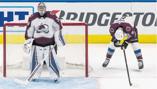  ?? Jason Franson, The Canadian Press ?? Avs goalie Pavel Francouz and teammate Cale Makar react to a goal scored on a mishandled puck in the third period Sunday.