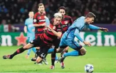  ?? Reuters ?? Taking a tumble Barcelona’s Gerard Gumbau is brought down by Bayer Leverkusen’s Kevin Kampl during their clash at BayArena.