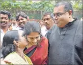  ?? PTI ?? DMK MP Kanimozhi celebrates with her husband G Aravindan and mother Rajathi Ammal (left) after she was acquitted by a special court in the 2G scam case in New Delhi on Thursday.