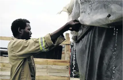  ?? / TIRO RAMATLHATS­E ?? Sello James shows Sowetan team his rickety shack at Matsatseng Informal settlement opposite the PPC plant.