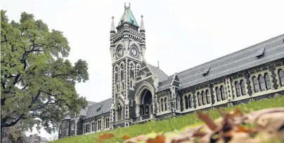  ?? PHOTO: ODT FILES ?? The University of Otago’s signature clock tower (above). At right: Staff and students protest against cuts to support staff at the university last year.