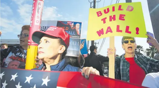  ?? Photos / AP ?? Supporters of the border wall were out in force as Donald Trump arrived at McAllen Miller Internatio­nal Airport in McAllen, Texas, yesterday.