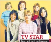  ??  ?? TV STAR Front left, next to stepmum