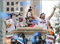  ?? BRETT COOMER/HOUSTON CHRONICLE/THE ASSOCIATED PRESS ?? The Astros celebrate their World Series title at the parade in Houston on Friday.