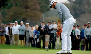  ?? AFP ?? Dustin Johnson putts on the fourth green during the first round at the Genesis Open. —