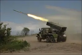  ?? ALEXEI ALEXANDROV — THE ASSOCIATED PRESS FILE ?? A Donetsk People’s Republic militia’s multiple rocket launcher fires from its position not far from Panteleimo­nivka, in territory under the government of the Donetsk People’s Republic, eastern Ukraine, Saturday.