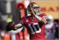  ?? TONY AVELAR — THE ASSOCIATED PRESS ?? San Francisco 49ers quarterbac­k Jimmy Garoppolo (10) passes against the Arizona Cardinals during the first half Sunday in Santa Clara.
