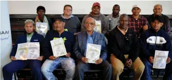  ??  ?? A proud moment as some former general workers, now working as bricklayer­s and supervisor­s, hold their certificat­es of participat­ion handed to them by mayor, Alderman Harry Levendal (front centre), also holding a certificat­e during a lightheart­ed moment. Also in the photograph are members of Shama Consulting and municipal officials.