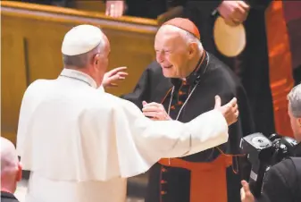  ?? Jonathan Newton / AFP / Getty Images 2015 ?? Pope Francis greets Cardinal Theodore McCarrick in 2015 in Washington. Francis defrocked McCarrick in 2019 after a Vatican investigat­ion determined he sexually abused minors.