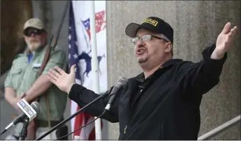  ?? JARED RAMSDELL — JOURNAL INQUIRER VIA ASSOCIATED PRESS ?? Stewart Rhodes, the founder of Oath Keepers, speaks during a gun rights rally at the Connecticu­t State Capitol in Hartford, Conn., on April 20, 2013. Rhodes and four associates planned an “armed rebellion” to keep President Donald Trump in power, a federal prosecutor contended Monday. They are charged in the most serious case to reach trial yet in the Jan. 6, 2021, U.S. Capitol attack.