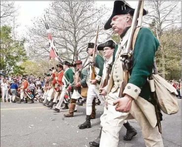  ?? Scott Mullin / Hearst Connecticu­t Media file photo ?? Reenactors march toward Main Street for the 240th anniversar­y of the Battle of Ridgefield in 2017.