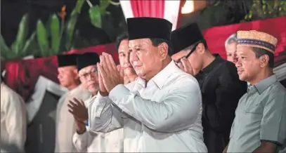  ?? AGUNG KUNCAHYA B. / XINHUA ?? Indonesia’s President-elect Prabowo Subianto greets supporters at a gathering in Jakarta on Wednesday. The nation’s General Elections Commission announced on Wednesday that Subianto and vice-presidenti­al candidate Gibran Rakabuming Raka had won the presidenti­al election, which was held on Feb 14.