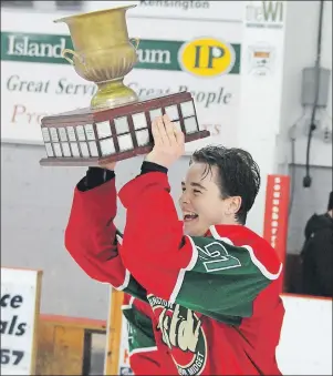  ?? JASON SIMMONDS/TC MEDIA ?? Kensington Monaghan Farms Wild team captain Tayler Read of Wilmot Valley is all smiles as he hoists the provincial major midget hockey championsh­ip trophy on Saturday night. The Wild defeated the Charlottet­own Bulk Carriers Pride 6-1 in the seventh and...