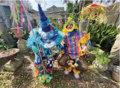  ?? ?? Paradegoer­s in costume are
seen during a Mardi Gras Parade during Mardi Gras on Tuesday in New Orleans. (Photo by Amy Harris/
Invision/AP)