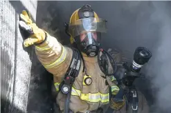  ?? The Sentinel-Record/Grace Brown ?? Q Hot Springs firefighte­r Spencer Hecke participat­es in a training exercise Thursday at the Hot Springs Fire Department training grounds. To view a gallery of training photos, visit https://bit.ly/38eNaYP.