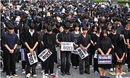  ?? Photograph: Jung Yeon-Je/AFP/Getty Images ?? Teachers attend a rally in Seoul, South Korea, calling for better rights for teaching staff, and mourning colleagues who have died by suicide.