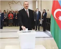  ?? (Reuters) ?? AZERBAIJAN PRESIDENT Ilham Aliyev casts his vote in Baku yesterday.