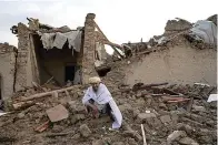  ?? (AP Photo/Ebrahim Nooroozi) ?? An Afghan sits by the rubble of his house earthquake in Gayan village, in Paktika province, Afghanista­n, Thursday, June 23, 2022. A powerful earthquake struck a rugged, mountainou­s region of eastern Afghanista­n early Wednesday, flattening stone and mud-brick homes in the country’s deadliest quake in two decades, the state-run news agency reported.