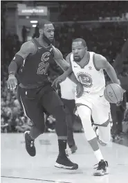  ?? AP PHOTO/TONY DEJAK ?? The Golden State Warriors’ Kevin Durant goes to the basket against the Cleveland Cavaliers’ LeBron James on Friday during Game 4 of the NBA Finals in Cleveland.