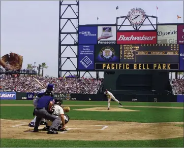  ?? THE ASSOCIATED PRESS — 2000 ?? The Giants’ Kirk Rueter delivers the first pitch at the new Pacific Bell Park to the Dodgers’ Devon White in San Francisco’s 2000 home opener. Catching is the Giants’ Doug Mirabelli. The Giants went on to lose 6-5.