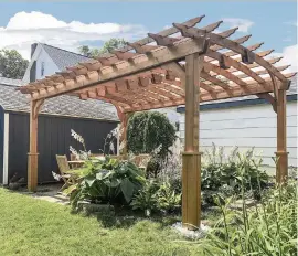  ?? Courtesy of Fifthroom.com ?? An arched top gives this cedar pergola an interestin­g look. It provides partial shade for the garden, but doesn’t block sunlight entirely.
