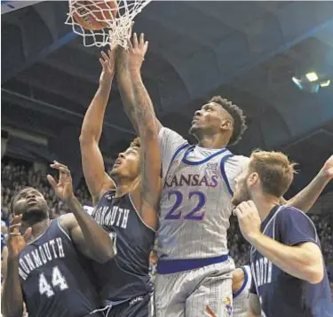  ?? GETTY ?? Kanas’ Silvio De Sousa makes a layup against Monmouth during the first half on Friday night.