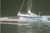  ?? CHICAMACOM­ICO BANKS FIRE AND RESCUE ?? A 30-foot-sailboat is grounded in the surf zone off the Outer Banks late Sunday.