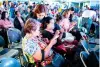  ?? CONTRIBUTE­D PHOTO ?? n Globe volunteer Janette Patricia Guillen (standing) assists senior participan­ts at Globe’s ‘Teach Me How to Digi’ learning session at SM North EDSA Sky Dome on Jan. 25, 2024.