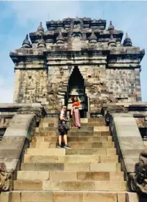  ??  ?? Peterey and Anne Drew stand on the steps leading to Candi Mendut Temple