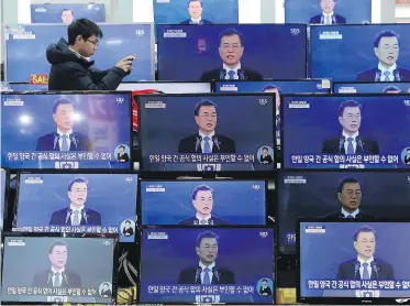  ??  ?? Television sets show South Korean President Moon Jae-in giving his annual New Year’s Day speech. Moon is trying to improve relations with North Korea.