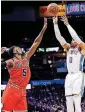  ?? [PHOTO BY NATE BILLINGS, THE OKLAHOMAN] ?? Thunder star Russell Westbrook, right, puts up a shot over Chicago’s Bobby Portis earlier this month at Chesapeake Energy Arena.