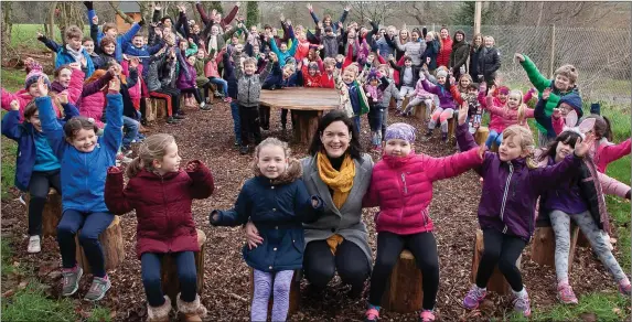  ??  ?? Students and staff at St Saviour’s NS visit their outdoor classroom to celebrate winning the public vote in the Irish Wildlife Trust’s Learning Together for Biodiversi­ty Award.