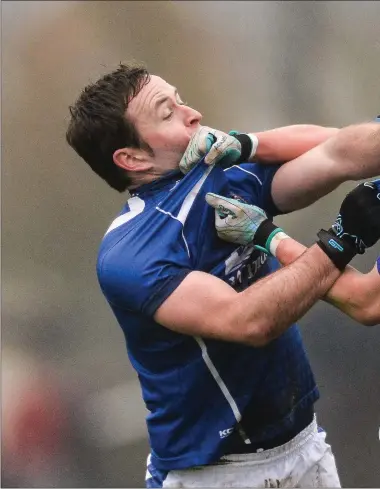  ??  ?? Ciarán Lynam of St Loman’s Mullingar and Brian McGrath (Simonstown) tangle after the half-time whistle in the