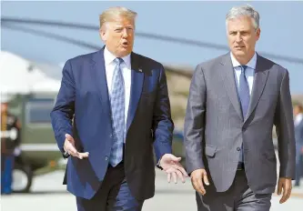  ?? AP-Yonhap ?? U.S. President Donald Trump and Robert O’Brien, just named as the new national security adviser, walk to speak to the media at Los Angeles Internatio­nal Airport in Los Angeles, Wednesday.