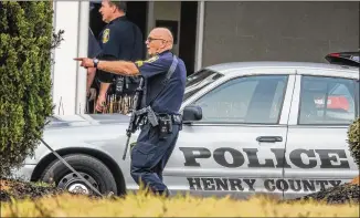  ?? JOHN SPINK PHOTOS / JSPINK@AJC.COM ?? A Henry County hotel was evacuated after a man walked in carrying at least one gun, opened fire and shot out the door early Monday. No guests or employees of the Home2 Suites by Hilton were injured in the incident, Capt. Joey Smith said.