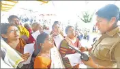  ?? VIVEK R NAIR/ HT FILE ?? A police personnel checks the age proof of women devotees at Sabarimala Temple, on November 16, 2019.