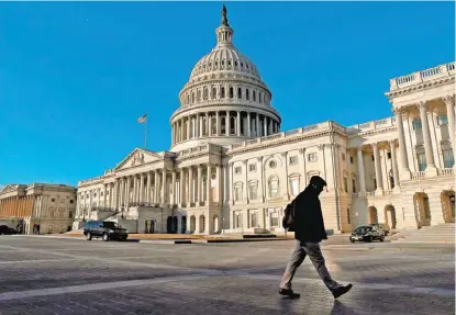  ?? LEAH MILLIS/REUTERS ?? Se espera que este día se logre un acuerdo en ambas cámaras legislativ­as de Estados Unidos.