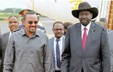  ?? — Reuters ?? Ethiopia’s Prime Minister Abiy Ahmed is received by South Sudan’s President Salva Kiir at the Juba Internatio­nal Airport in Juba.