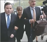  ?? The Associated Press ?? TRIAL: Actress Allison Mack, center, arrives with her legal team to Brooklyn Federal Court on Friday in New York. The former "Smallville" actress appeared before a federal judge along with Keith Raniere, the leader of the self-help group NXIVM.