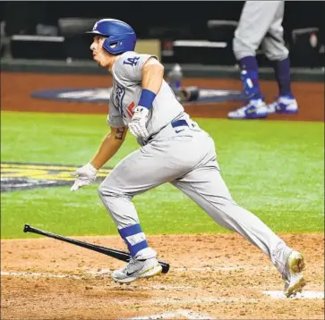  ?? AUSTIN BARNES Wally Skalij Los Angeles Times ?? watches his home run in the sixth inning. Barnes also laid down a bunt to score a run.