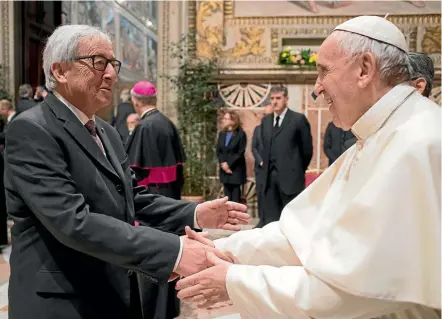  ??  ?? Pope Francis greets European Commission President Jean-Claude Juncker at the Vatican as European Union leaders gather in Rome to celebrate the bloc’s 60th anniversar­y.