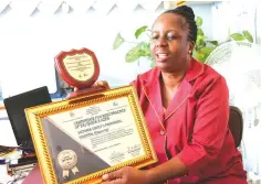  ?? Picture: Tinai Nyadzayo ?? Victoria Chitepo Provincial Hospital’s public relations focal person, Sister Clara Mutasa displays the shield and certificat­e won by the hospital during the quality improvemen­t of health service competitio­n. —