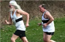  ??  ?? Above: runners compete at the VAC 5000m Champs at Battersea Park, London. Below: Liam O’Hare and Gary Budinger compete in the Surrey Cross-Country League.